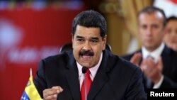 FILE - Venezuela's President Nicolas Maduro speaks during an ALBA alliance summit to mark fourth anniversary of the death of Venezuela's late President Hugo Chavez in Caracas, March 5, 2017.