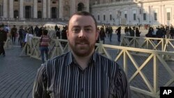 Vincent Doyle, of advocacy group Coping International, poses for a photo during an interview with The Associated Press, in St. Peter's Square at the Vatican, Feb. 20, 2019. 