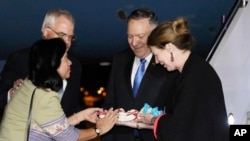 Secretary of State Mike Pompeo and his wife Susan are greeted with flowers by U.S. Embassy Chargé d'Affaires Peter Haymond and his wife Dusadee after they arrive in Bangkok, Thailand, Aug. 1, 2019. 
