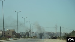 FILE - An airstrike hits a Tripoli suburb July 7, 2019, as forces loyal to the Government of National Accord in the west battled forces loyal to Khalifa Haftar. (H. Murdock/VOA)