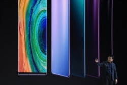 FILE - Richard Yu, head of Huawei's consumer business group, speaks on stage during a presentation to reveal Huawei's latest smartphones Mate 30 and Mate 30 Pro in Munich, Germany, Sept. 19, 2019.