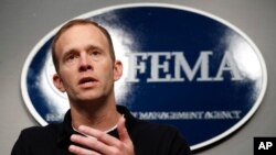 FILE - Federal Emergency Management Agency Administrator Brock Long speaks during a news conference in Washington, Aug. 31, 2017. At FEMA headquarters, top officials responsible for responding to large-scale public emergencies meet regularly to conduct drills and update plans covering numerous worst-case scenarios. That includes what to do if two massive hurricanes strike the U.S. mainland within days, 1,000 miles apart. Those plans are now being put into action.