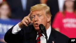 President Donald Trump addresses the crowd during a campaign rally Friday, Sept. 21, 2018, in Springfield, Mo. 