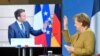 German Chancellor Angela Merkel waves to French President Emmanuel Macron at the end of a press conference following German-French Security Council video talks in Berlin, Germany, Feb. 5, 2021.