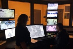FILE - In this Sept. 12, 2019, photo, County Sheriff Janis Mangum stands in a control room at the county jail in Jefferson, Georgia. A ransomware attack in March took down the office's computer system.