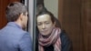 FILE - Russian-American journalist for Radio Free Europe/Radio Liberty Alsu Kurmasheva, who is in custody after she was accused of violating Russia's law on foreign agents, listens to a lawyer at a court hearing in Kazan, Russia, Dec. 1, 2023.