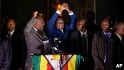 Asylum-seekers wait for news of policy changes at the border in Tijuana, Mexico. After waiting months in Mexico, people seeking asylum in the U.S. are being permitted to enter the country starting Feb. 19, 2021, as they wait for courts to decide on their cases.