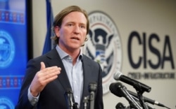 FILE - U.S. Cybersecurity and Infrastructure Security Agency Director Christopher Krebs speaks to reporters at CISA’s Election Day Operation Center on Super Tuesday in Arlington, Va., March 3, 2020.