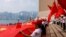 资料照：在香港的亲北京人士挥舞中国国旗庆祝中国国庆日。（2021年9月28日）