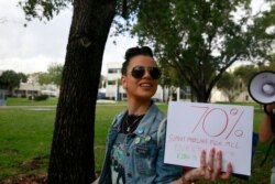 Adriana Romero chants during the Bernie 2020 March to Early Vote at Florida International University to on March 11, 2020, in Miami.