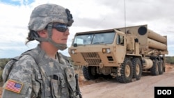 A U.S. soldier guards a part of the THAAD missle system.