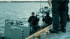 Arhiv - Ronioci ratne mornarice Letonije učestvuju u NATO vježbi u Baltičkom moru, 23. novembra 2024.