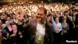 Ordinary People and Independent Personalities party leader Igor Matovic gestures with supporters at his party's headquarters after the country's parliamentary elections, in Trnava, Slovakia, March 1, 2020. 