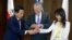 South Korea's Defense Minister Han Min-koo shows U.S. Secretary of Defense Jim Mattis and Japan's Defense Minister Tomomi Inada how to do a handshake during a trilateral meeting on the sidelines of the 16th IISS Shangri-La Dialogue in Singapore, June 3,