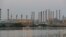 FILE - A view of the Abadan oil refinery in southwest Iran, from the Iraqi side of the Shatt al-Arab waterway, south of Basra, Sept. 21, 2019.