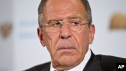 A radio-controlled flying witch makes a test flight past a moon setting into clouds along the pacific ocean in Carlsbad, California. Reuters was invited to photograph the testing of the life sized device by inventor Otto Dieffenbach lll.
