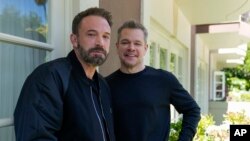 Ben Affleck, left, and Matt Damon pose for a portrait to promote the film "Air" on March 27, 2023 in Los Angeles. (AP Photo/Ashley Landis)