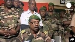 TV frame grab shows Colonel Gokoye Abdul Karimou, spokesman for the Niger millitary junta delivering a televised statement in Niamey, 19 Feb 2010