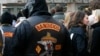 FILE - Members of motorcycle gang 'Bandidos' wait in front the regional court in Muenster.