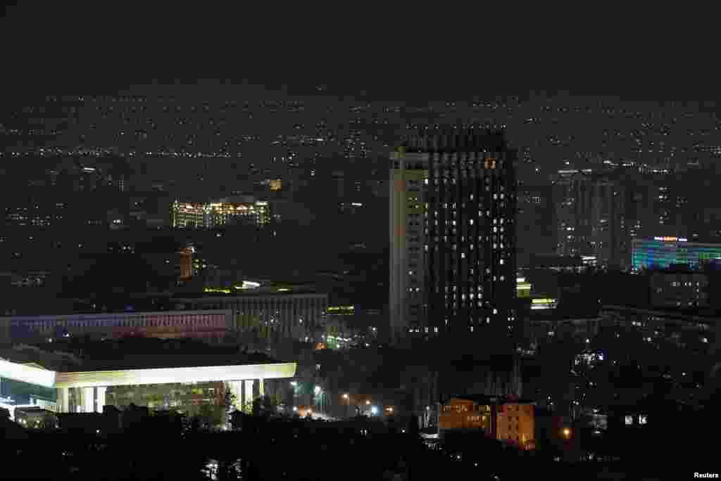 The hotel "Kazakhstan" is seen after the lights are switched off for Earth Hour in Almaty, Kazakhstan, March 30, 2019.