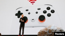 FILE - Google vice president and general manager Phil Harrison speaks during a Google keynote address announcing a new video gaming streaming service named Stadia, at the Gaming Developers Conference in San Francisco, California, U.S., March 19, 2019. 