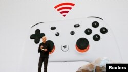 FILE - Google vice president and general manager Phil Harrison speaks during a Google keynote address announcing a new video gaming streaming service named Stadia, at the Gaming Developers Conference in San Francisco, California, U.S., March 19, 2019. 