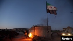 A Turkey-backed Free Syrian Army fighter is seen in Qastal village in east Afrin, Syria, Jan. 30, 2018.