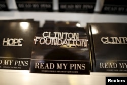 FILE - A Clinton Foundation brooch is seen for sale at the Clinton Museum Store in Little Rock, Arkansas, United States April 27, 2015. The Clinton Foundation's acting chief executive admitted on Sunday that the charity had made mistakes on how it listed