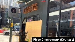 The Lapats Thai Noodle Bar is boarded up with plywood after being damaged from the explosion in Tenderloin, San Francisco, CA