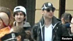 Tamerlan Tsarnaev, right of picture, was shot dead by Boston police early Friday morning. His younger brother Dzhokhar Tsarnaev, left, remains at large. REUTERS