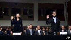 Facebook COO Sheryl Sandberg, left, accompanied by Twitter CEO Jack Dorsey are sworn in before the Senate Intelligence Committee hearing on 'Foreign Influence Operations and Their Use of Social Media Platforms' on Capitol Hill, Sept. 5, 2018, in Washingto