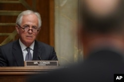 FILE - Chairman Sen. Bob Corker, R-Tenn., left, listens during a Senate Foreign Relations Committee hearingon Capitol Hill in Washington, Nov. 14, 2017.