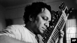In this 1967 file photo, Ravi Shankar plays his sitar in Los Angeles, California.