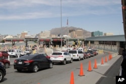 Vehicles from Mexico and the U.S. approach a border crossing in El Paso, Texas, April 1, 2019.
