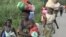 People shown leaving Begoua for capital Bangui in Central African Republic in this still image taken from video on March 23, 2013.