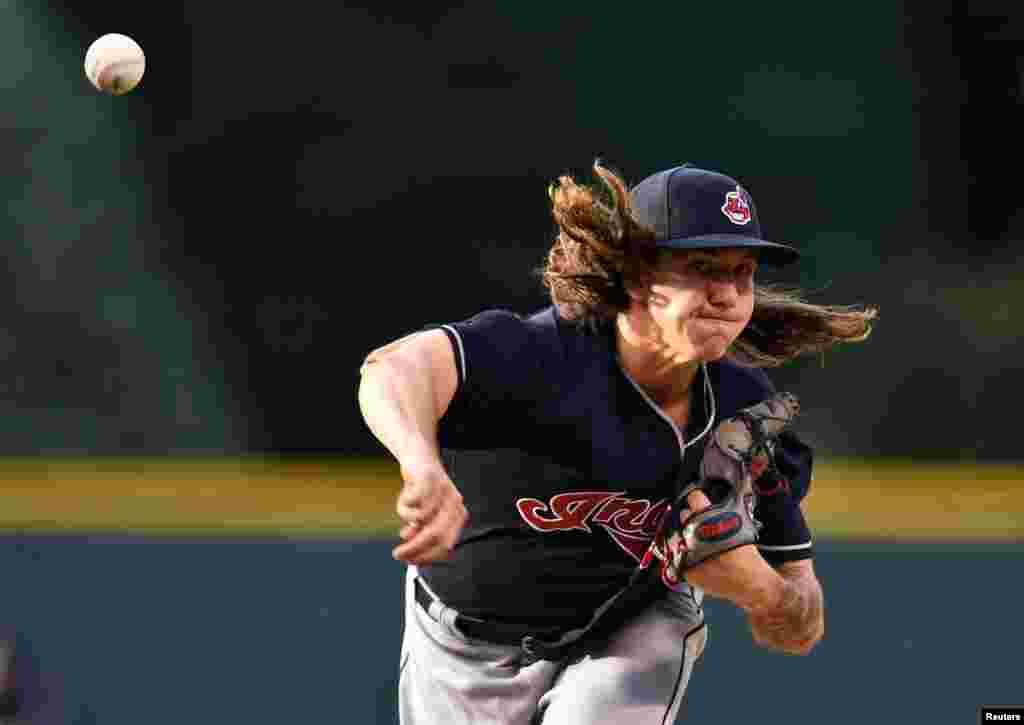 Cleveland Indians starting pitcher Mike Clevinger (52) throws in the first inning against the Colorado Rockies at Coors Field in Denver, Colorado. (Credit: Ron Chenoy/USA TODAY Sports)