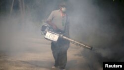 A worker sprays insecticide for mosquitos in Bangkok, Thailand, Jan. 13, 2016. Tropical Southeast Asian countries said they were bracing for the Zika virus, with Malaysia saying it could "spread quickly" if introduced. 