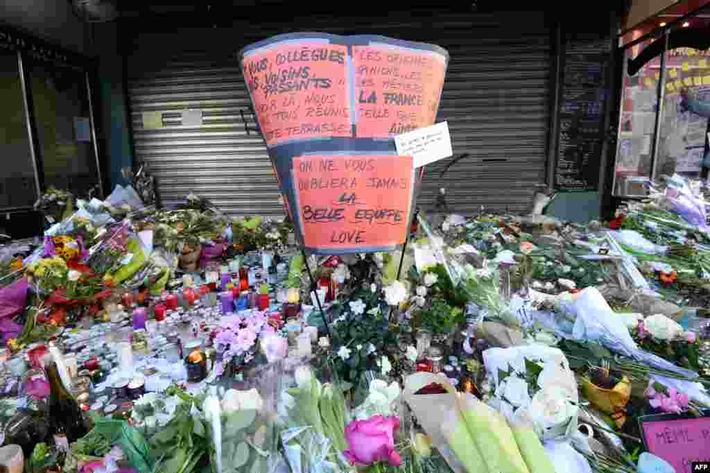 Flowers, candles and messages left as a memorial outside of La Belle Equipe bar, in the 11th district of Paris, following a series of coordinated terrorists attacks on November 13. 