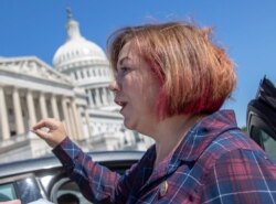 FILE - Rep. Linda Sanchez, D- Calif., pauses for a reporter's question on Capitol Hill in Washington, July 18, 2018.