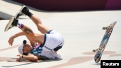 Jagger Eaton of the U.S. falls during the skateboarding competition in Tokyo. He is one of the popular social media athletes. (REUTERS/Toby Melville)