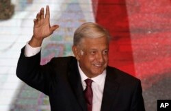 Presidential candidate Andres Manuel Lopez Obrador waves to supporters as he gives his first victory speech from his campaign headquarters in Mexico City, July 1, 2018.