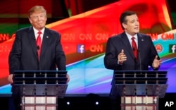 Ted Cruz, right, makes a point as Donald Trump reacts during the CNN Republican presidential debate at the Venetian Hotel & Casino on Dec. 15, 2015, in Las Vegas.