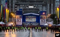 Venezuela's Bolivarian National guards officers occupy the Bolivar Avenue where the government said that a drone armed with explosives detonated near Venezuelan President Nicolas Maduro in Caracas, Venezuela, Saturday, Aug. 4, 2018.