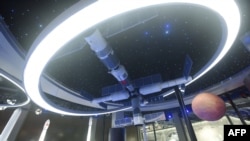 FILE - A model of China's Tiangong space station is seen at the Apsara Conference, a cloud computing and artificial intelligence (AI) conference, in Hangzhou, in China's eastern Zhejiang province, Oct. 19, 2021.