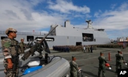 Philippine Marines, who took part in the battle against Muslim militants in the besieged city of Marawi in southern Philippines, are given a heroes welcome upon disembarking from the Philippine Navy amphibious ship BRP Tarlac, Oct. 30, 2017.
