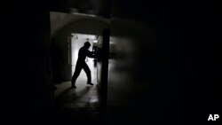 FILE - The second of two blast doors is opened, leading to the underground control room at an ICBM launch control facility near Minot, N.D., which staffed around the clock, June 24, 2014.