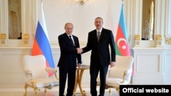 Vladimir Putin və İlham Əliyev görüşkən