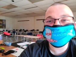 This June 2020 selfie photo shows Bill Mathis of Romeo, Mich., in one of the rooms where he taught high school English. (AP Photo via Bill Mathis)