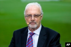 FILE - German legend former soccer player and coach Franz Beckenbauer attends a television show on May 17, 2014.