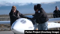 Members of the Perlan II project with the glider.